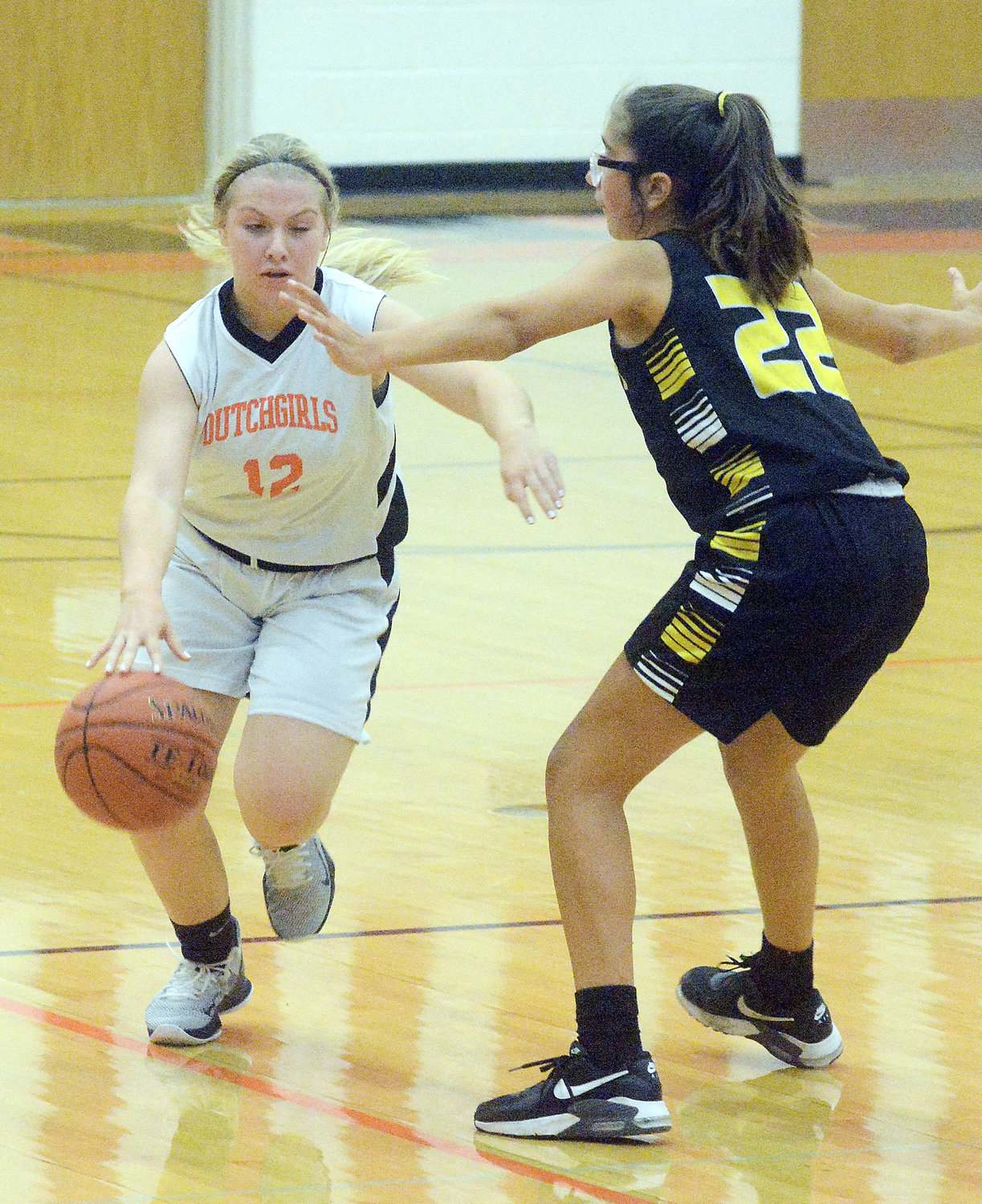 Lily Barker (above, left) drives past Sullivan’s Avaleigh Parks during eighth-grade basketball action between the host Dutchgirls and Lady Eagles last Tuesday night at Owensville Elementary School.
